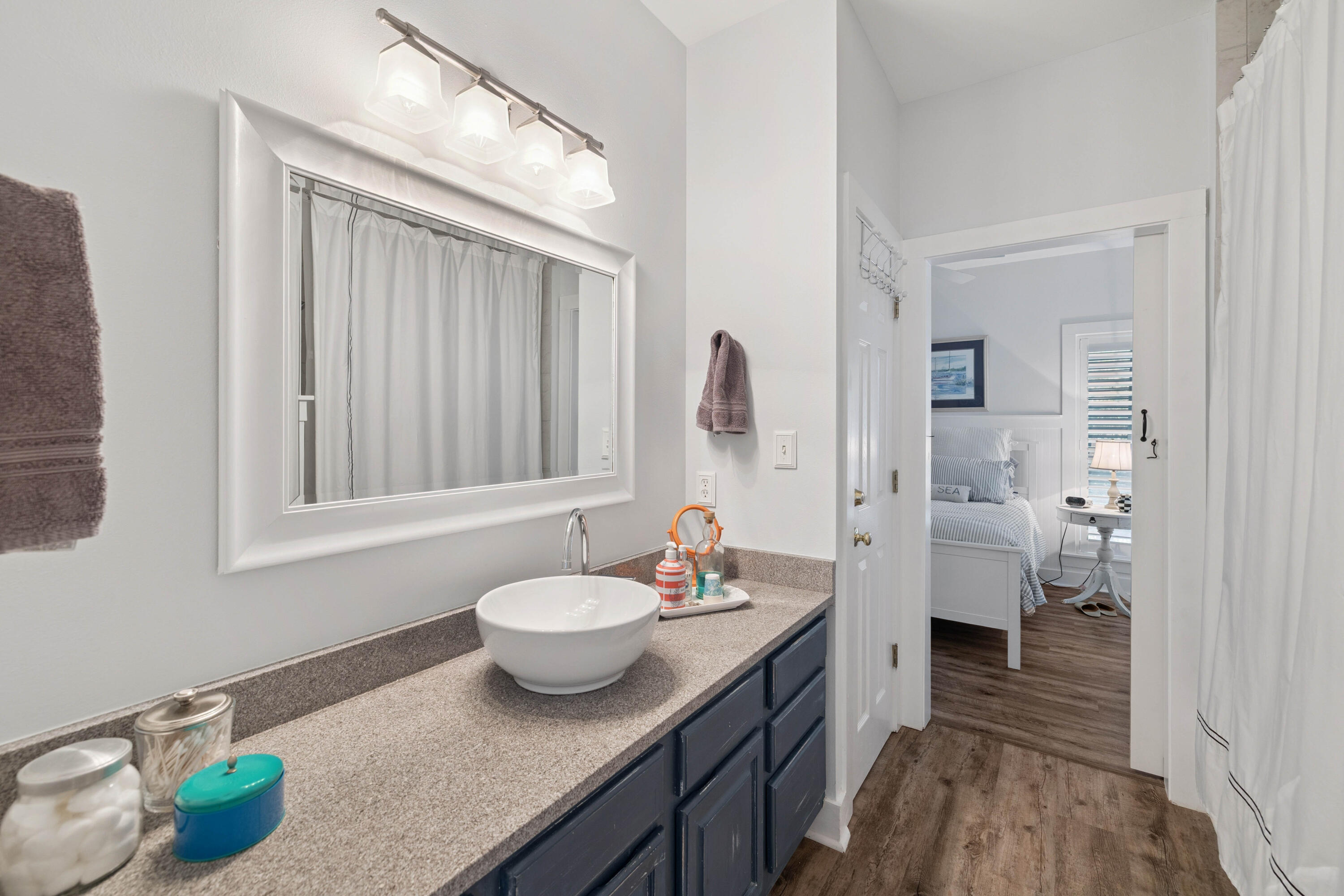 298 Cullman Avenue Santa Rosa Beach, FL 32459 - Photo 21 of 63 a en suite bathroom with a granite countertop sink and a mirror