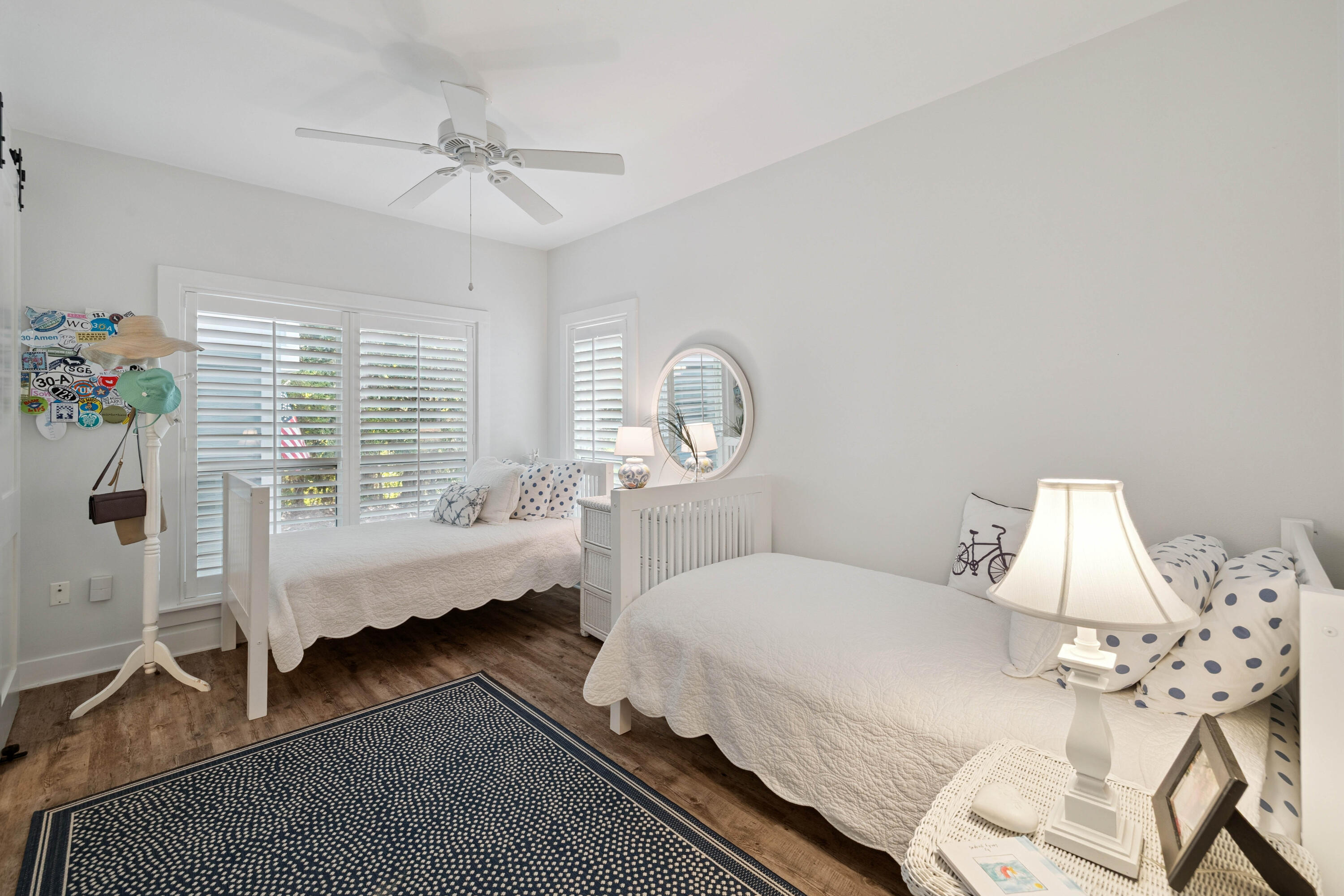 298 Cullman Avenue Santa Rosa Beach, FL 32459 - Photo 23 of 63 a bedroom with a bed a chandelier and a window