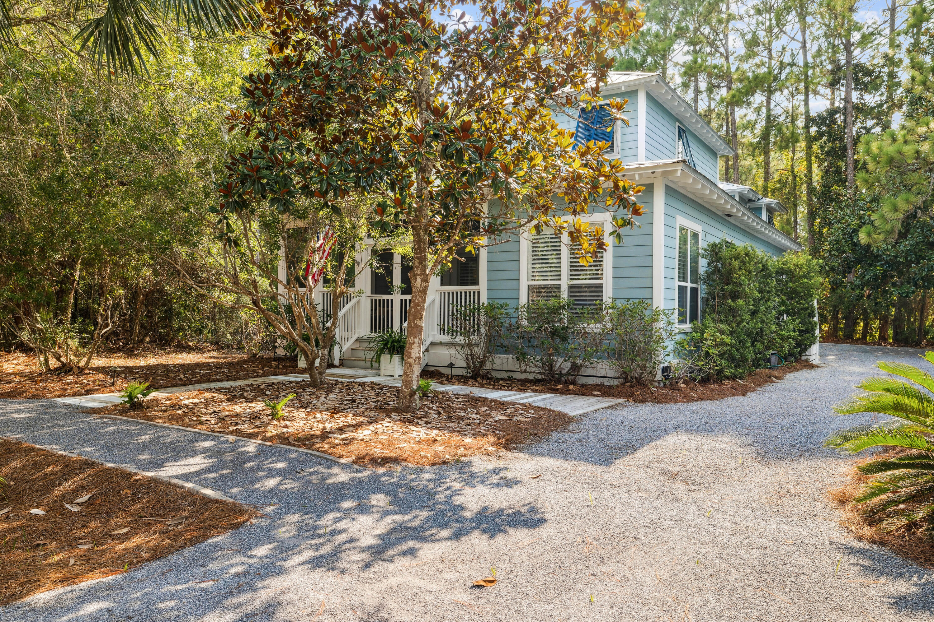 298 Cullman Avenue Santa Rosa Beach, FL 32459 - Photo 3 of 63 a view of a brick house with a yard and large tree
