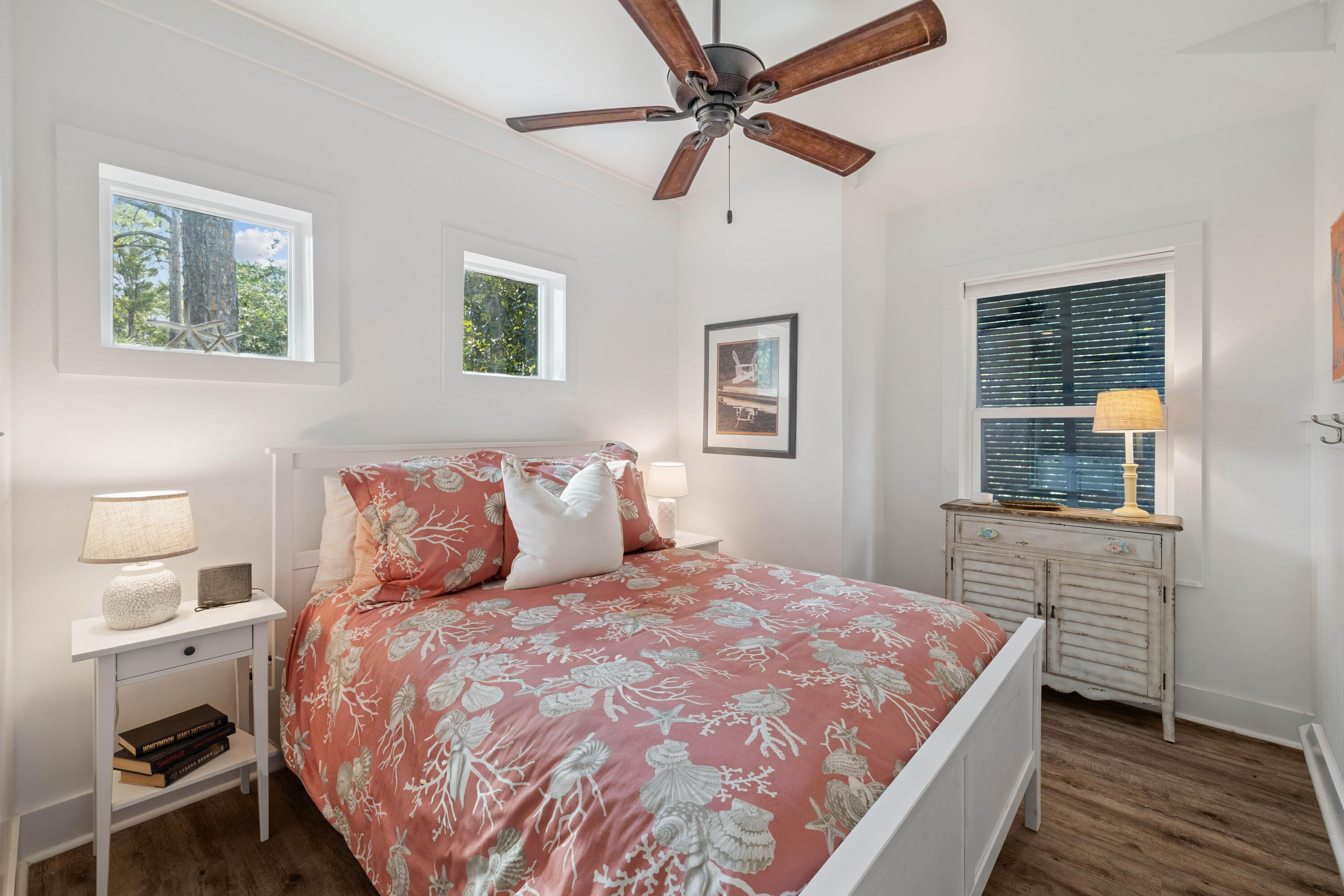 298 Cullman Avenue Santa Rosa Beach, FL 32459 - Photo 46 of 63 a bedroom with a large bed and a chandelier