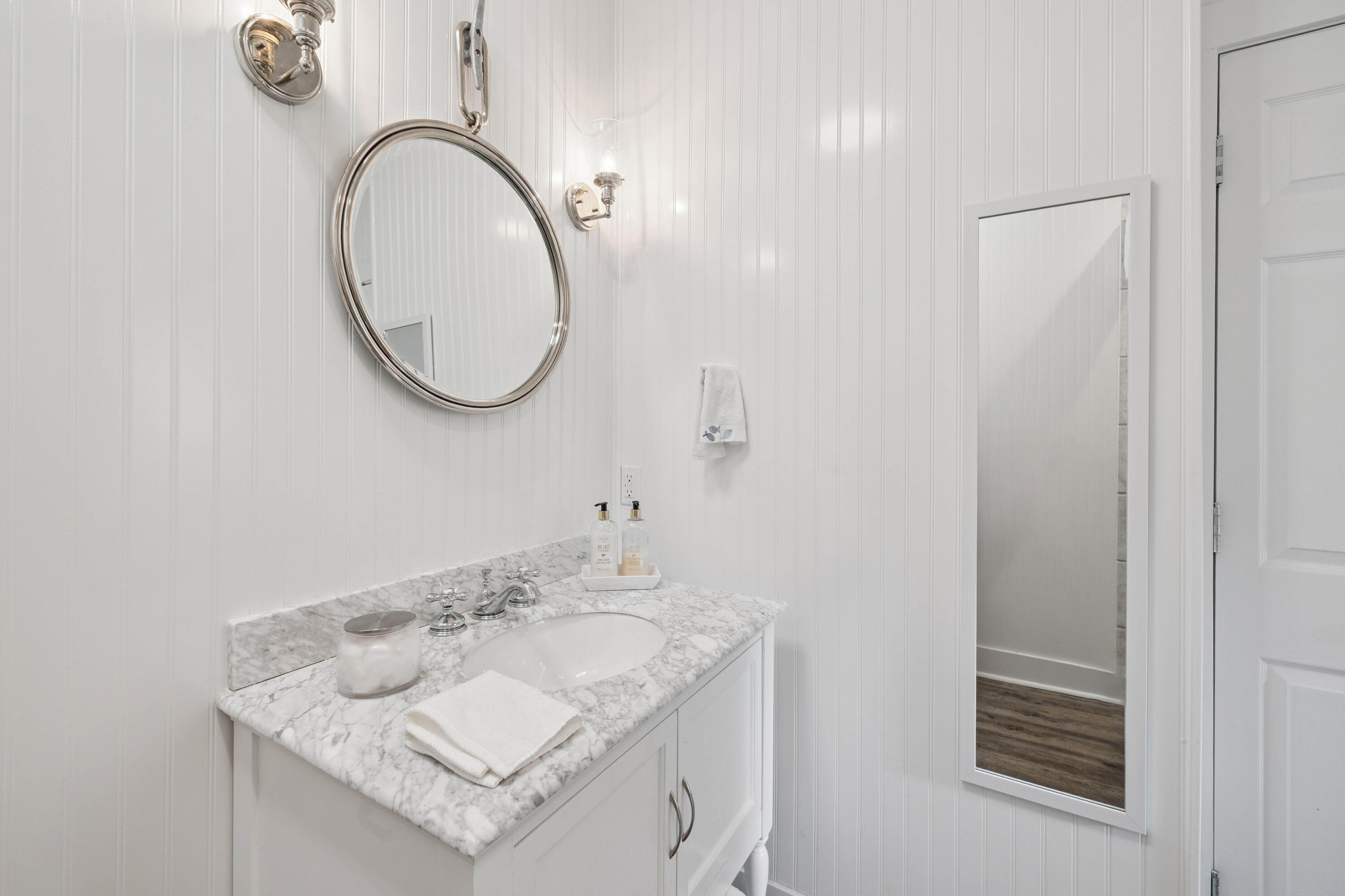 298 Cullman Avenue Santa Rosa Beach, FL 32459 - Photo 50 of 63 a bathroom with a granite countertop sink and a mirror
