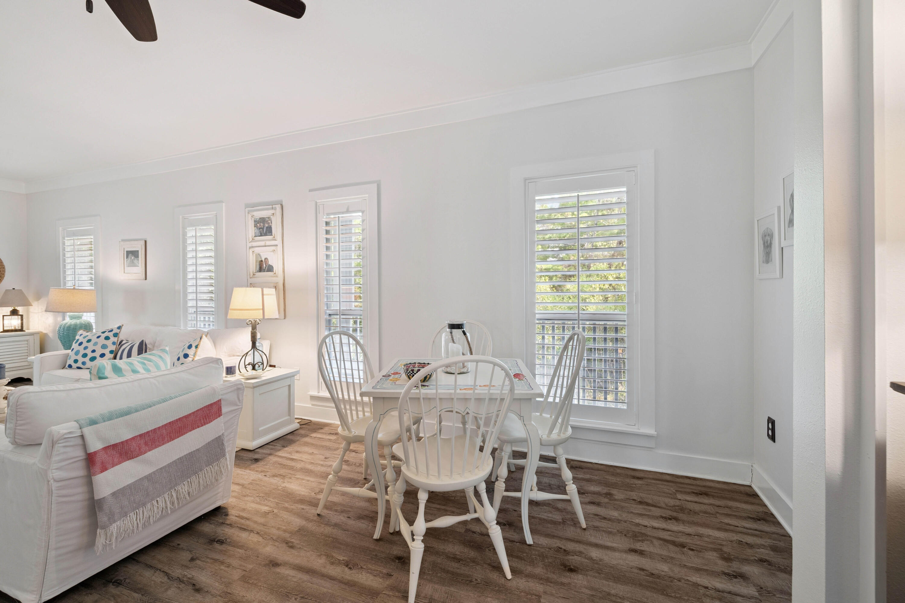 298 Cullman Avenue Santa Rosa Beach, FL 32459 - Photo 10 of 63 a view of a dining room with furniture and wooden floor