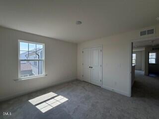 706 Old Station Angier, NC 27501 - Photo 15 of 19 a view of an empty room and a window