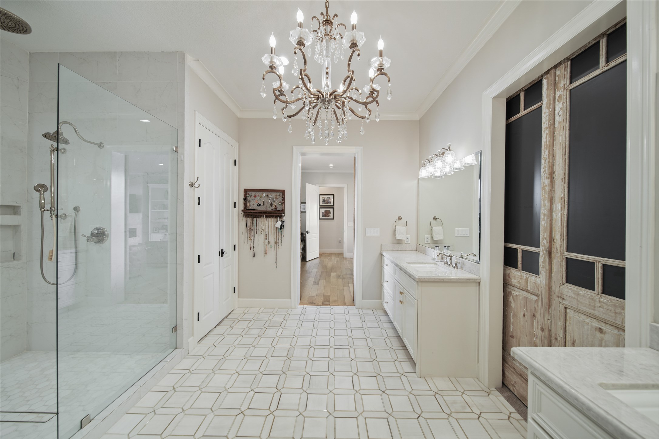 206 Avenue A Dickinson, TX 77539 - Photo 15 of 38 Beautifully Updated Primary Bath. Marble Counters, New Tile flooring, Designer Chandelier!