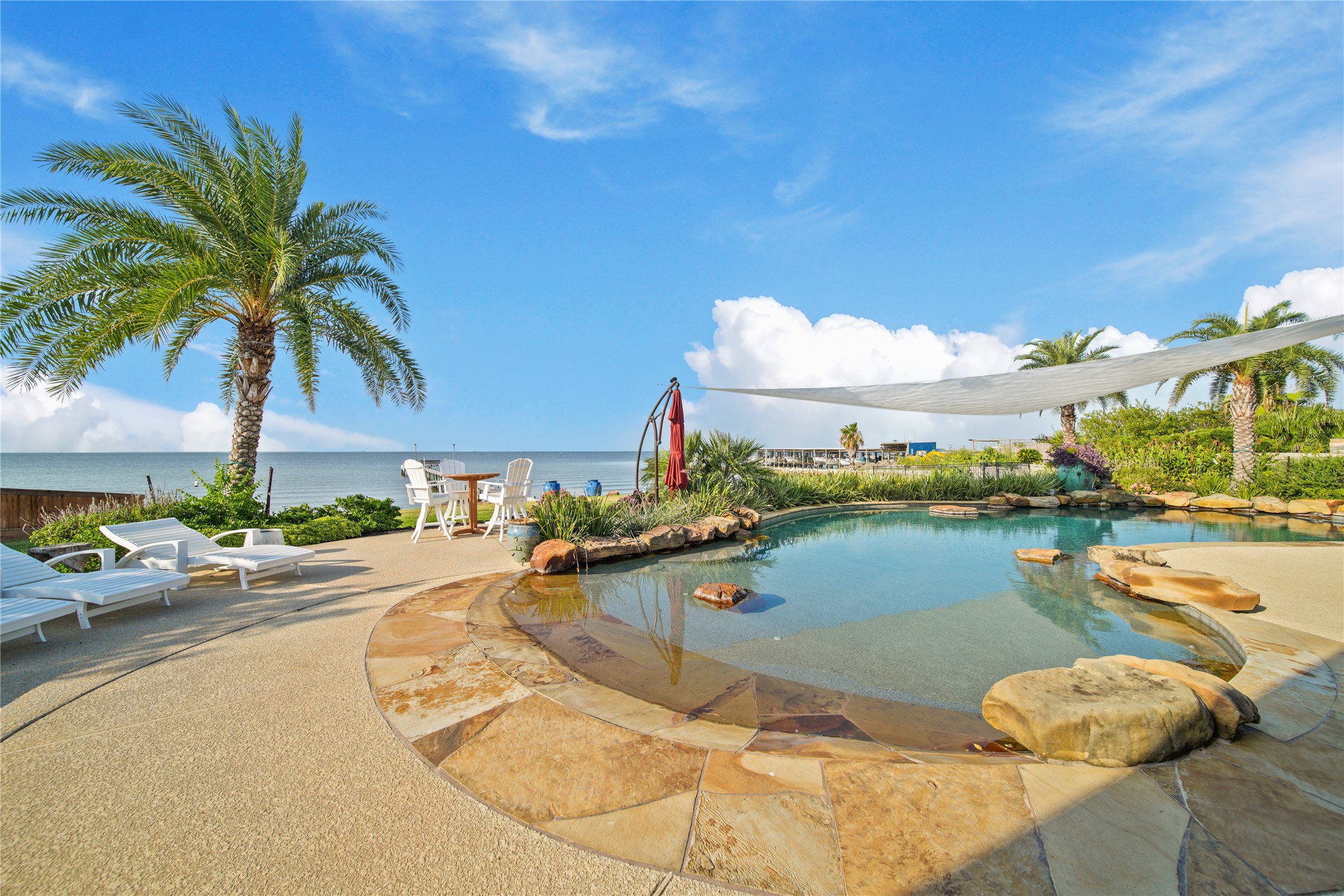 206 Avenue A Dickinson, TX 77539 - Photo 25 of 38 Resort Style Pool, Rockwall Water Feature, Beach Entry Pool!