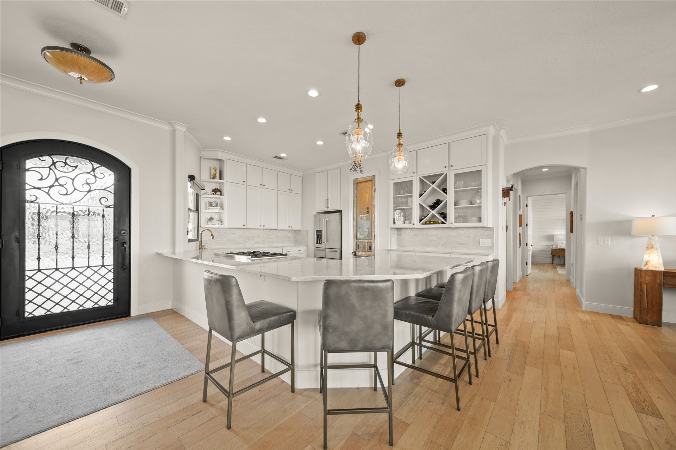 206 Avenue A Dickinson, TX 77539 - Photo 8 of 38 Fully Re-Designed Kitchen, Quartz Counters and Breakfast Bar, New Lighting, Stainless Steel Appliances, Built In wine rack and More!