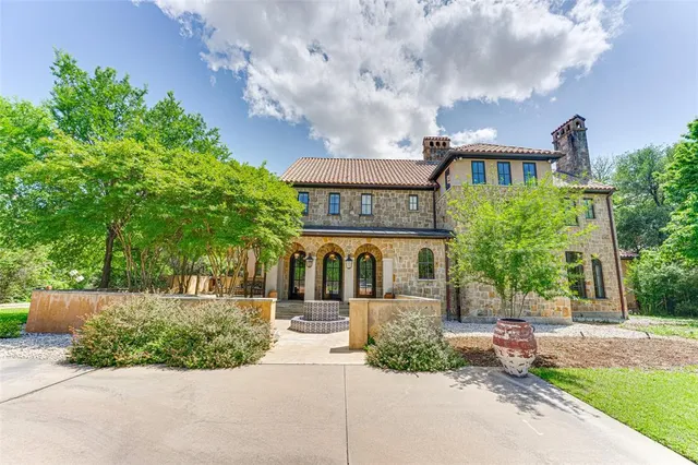 a front view of a building with garden