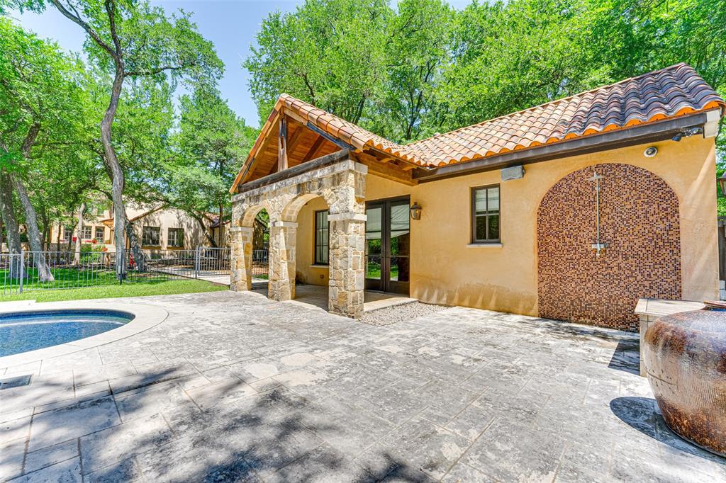 4120 Cochran Chapel Road Dallas, TX 75220 - Photo 33 of 40 a view of a house with a backyard and a tree