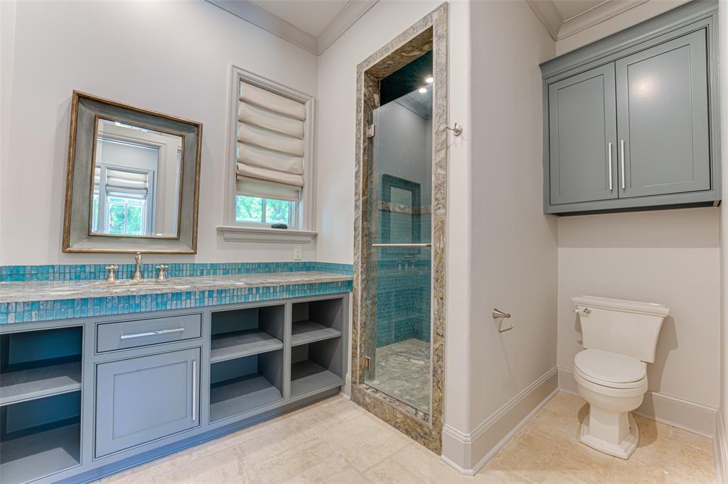 4120 Cochran Chapel Road Dallas, TX 75220 - Photo 35 of 40 Bathroom featuring ornamental molding, vanity, a stall shower, and tile patterned flooring