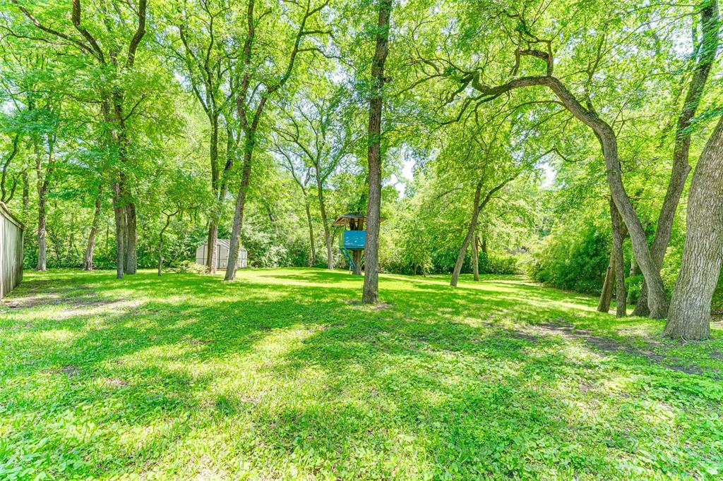 4120 Cochran Chapel Road Dallas, TX 75220 - Photo 38 of 40 a view of green field with trees in the background