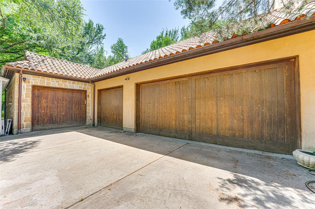 4120 Cochran Chapel Road Dallas, TX 75220 - Photo 40 of 40 Garage featuring driveway