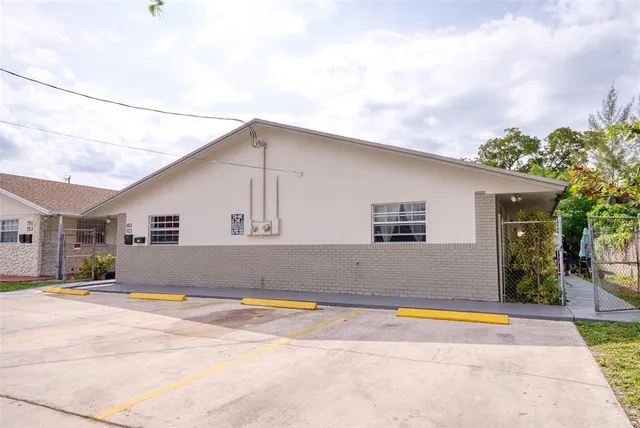 a potted plant sitting in front of a house