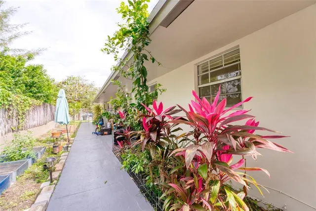 a living room with furniture and flowers