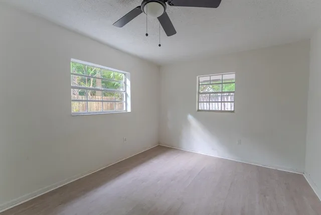a kitchen with granite countertop a sink and a stove top oven