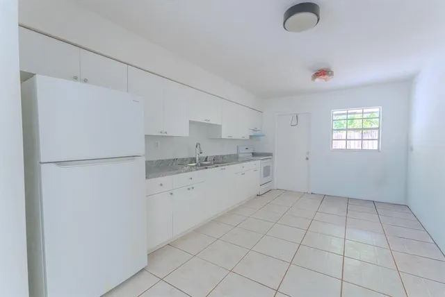 a view of a house with a sink and yard