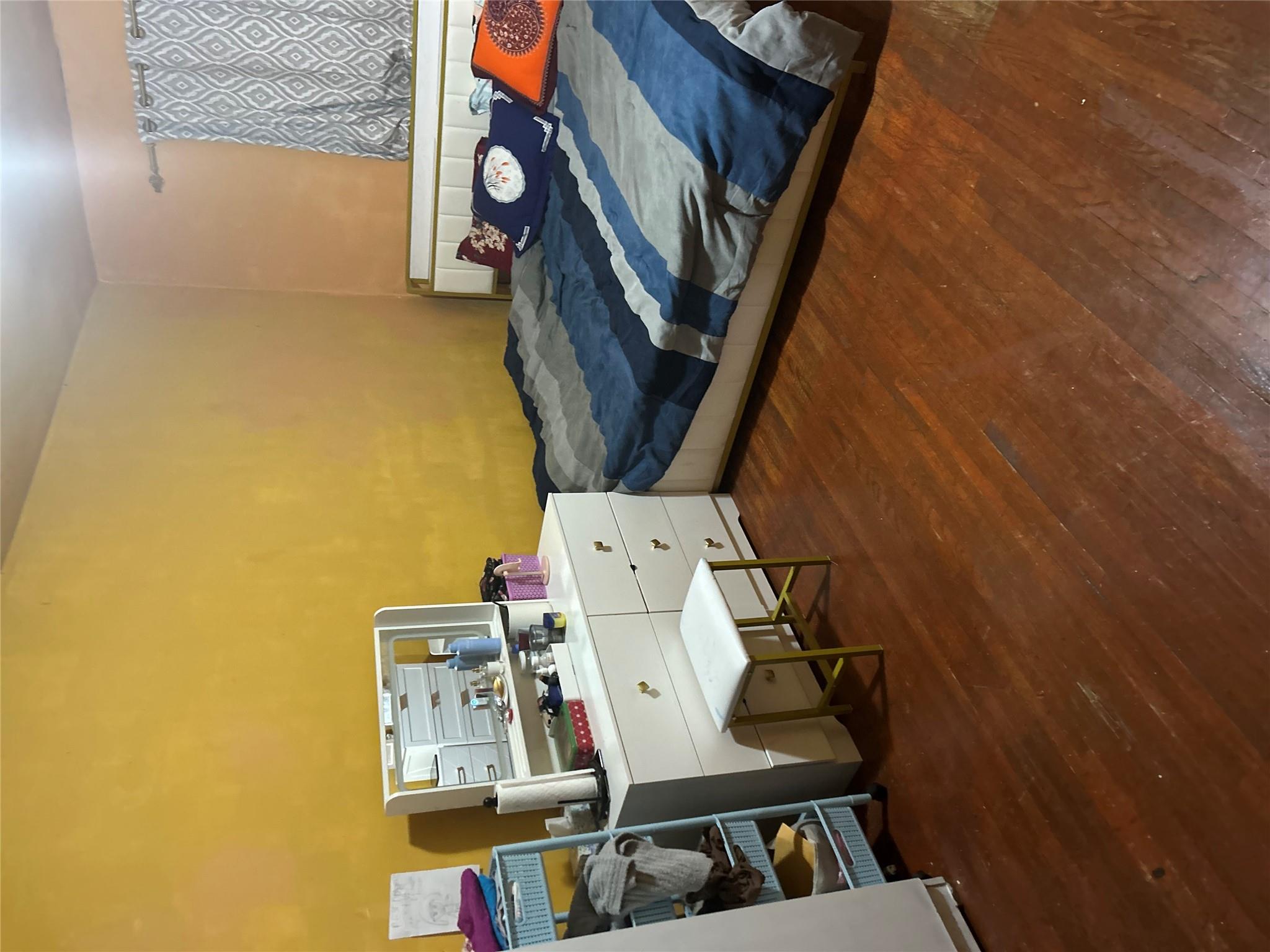 1210 White Plains Road Bronx, NY 10472 - Photo 4 of 5 Bedroom with dark wood-type flooring