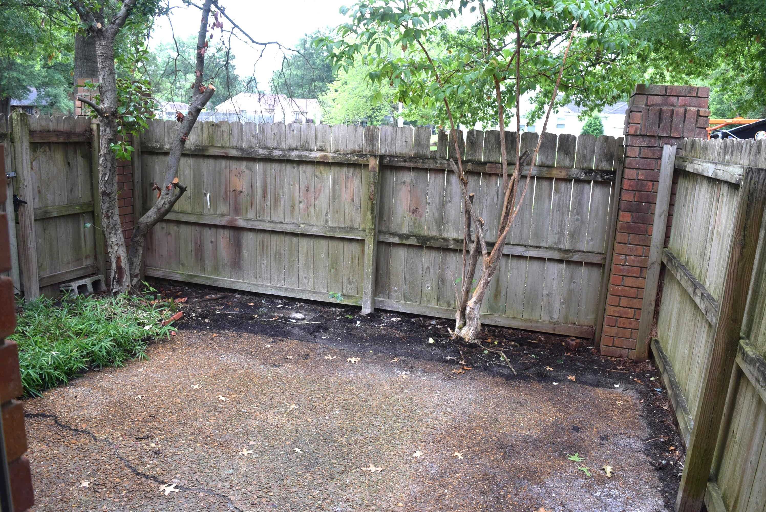 1831 Allenby Green, Unit 1831 Germantown, TN 38139 - Photo 19 of 25 a view of a backyard with wooden fence