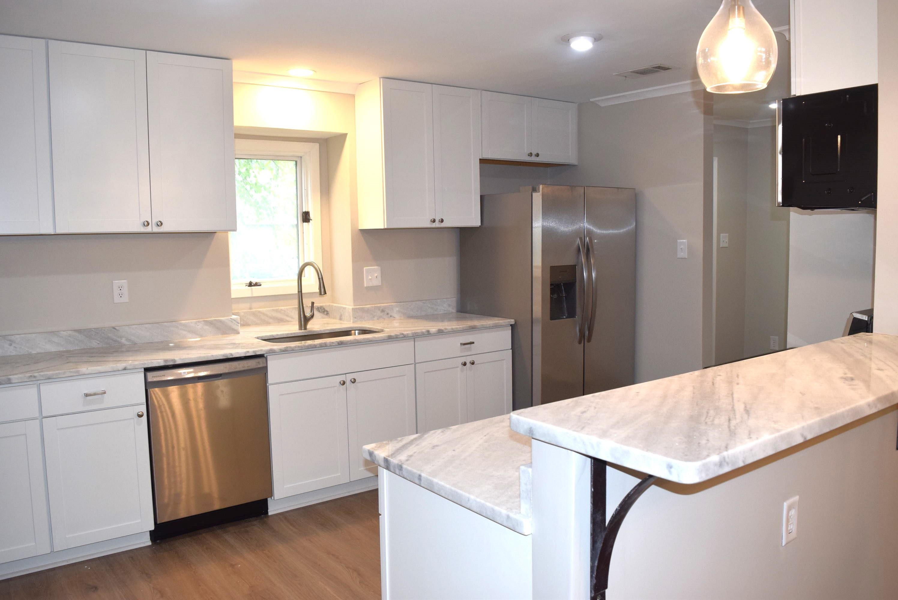 1831 Allenby Green, Unit 1831 Germantown, TN 38139 - Photo 3 of 25 a kitchen with a stove a sink and a refrigerator