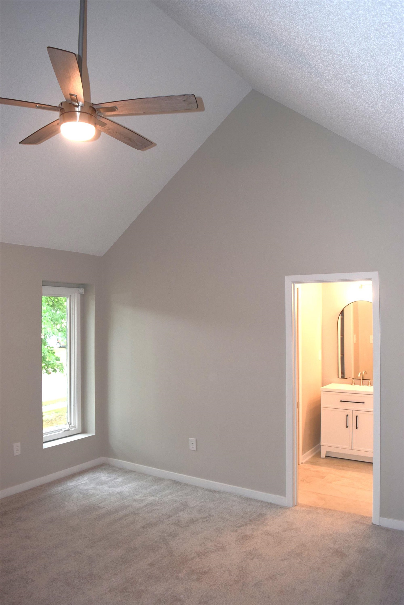 1831 Allenby Green, Unit 1831 Germantown, TN 38139 - Photo 8 of 25 a view of a room with a chandelier fan and a bathroom