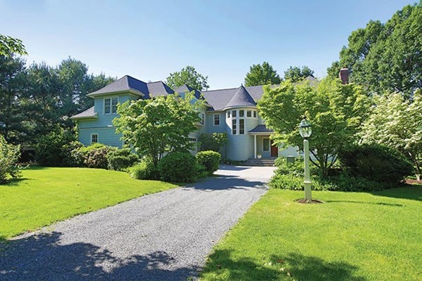 195 Newton Street Brookline, MA 02467 - Photo 1 of 16 a front view of a house with a yard and garage