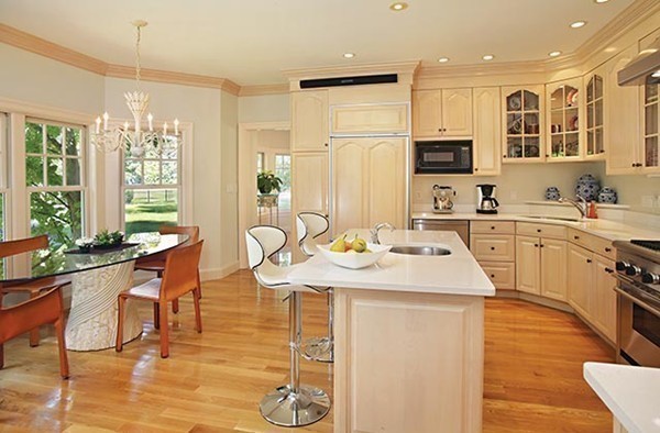 195 Newton Street Brookline, MA 02467 - Photo 11 of 16 a room with stainless steel appliances kitchen island granite countertop a sink and cabinets