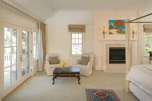 195 Newton Street Brookline, MA 02467 - Photo 14 of 16 a living room with furniture and a fireplace