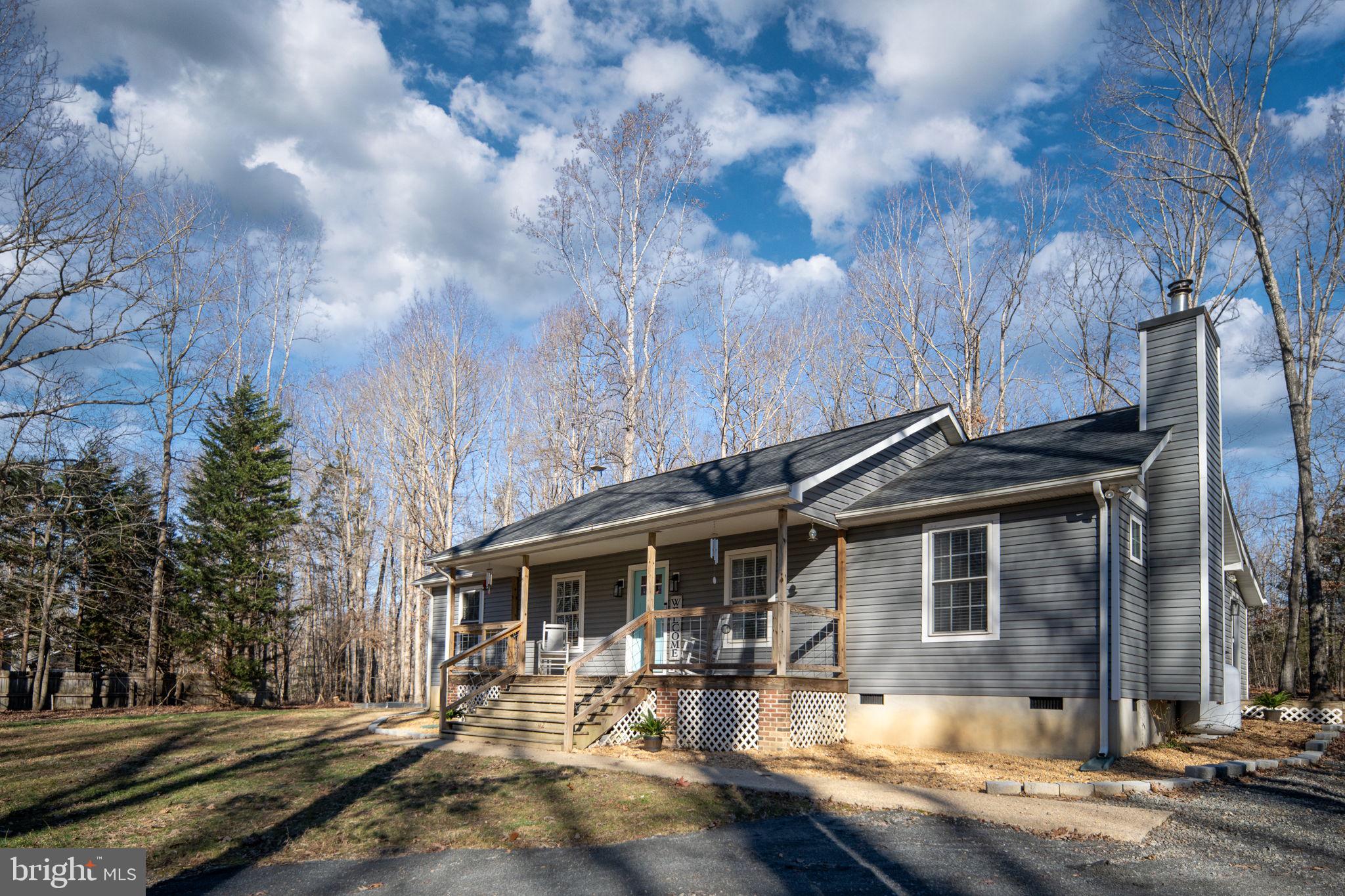 435 Halls Store Road Mineral, VA 23117 - Photo 11 of 59 a front view of a house with a yard