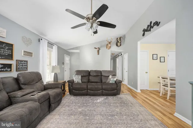 a spacious bathroom with a sink a mirror and a shower