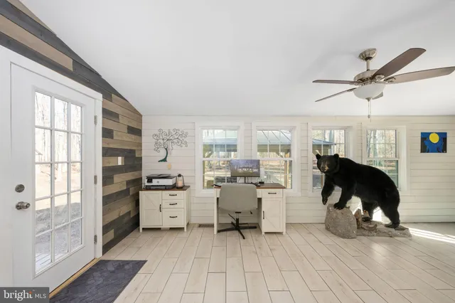 a view of hallway with wooden floor