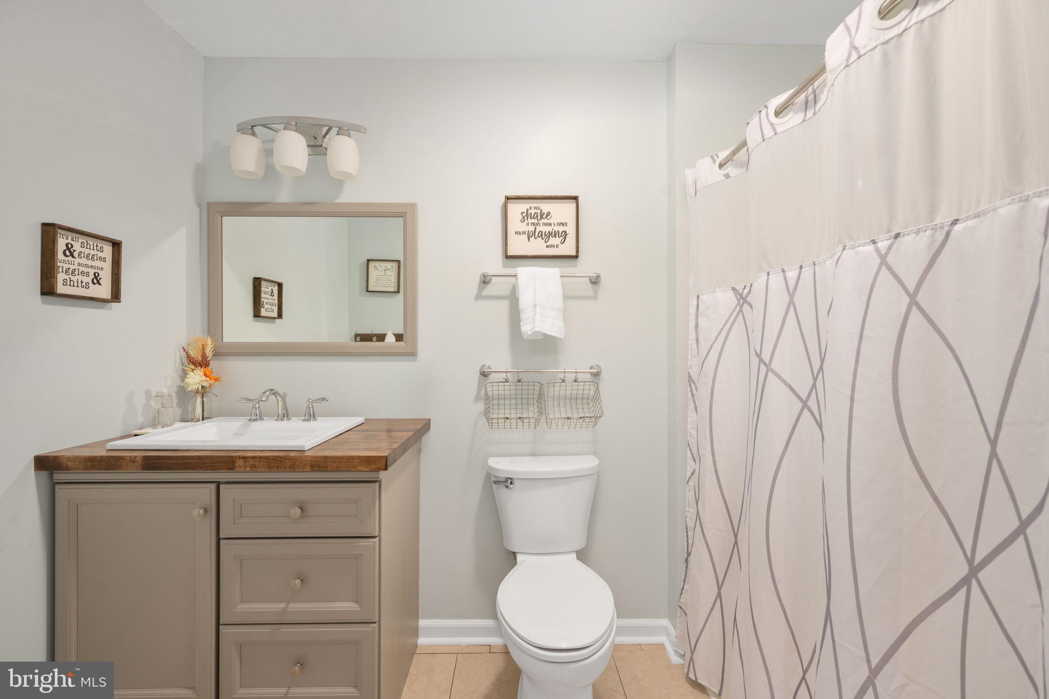 435 Halls Store Road Mineral, VA 23117 - Photo 33 of 59 a bathroom with a toilet sink and mirror