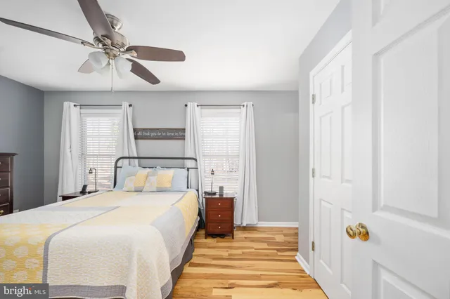 a view of room with window and wooden floor