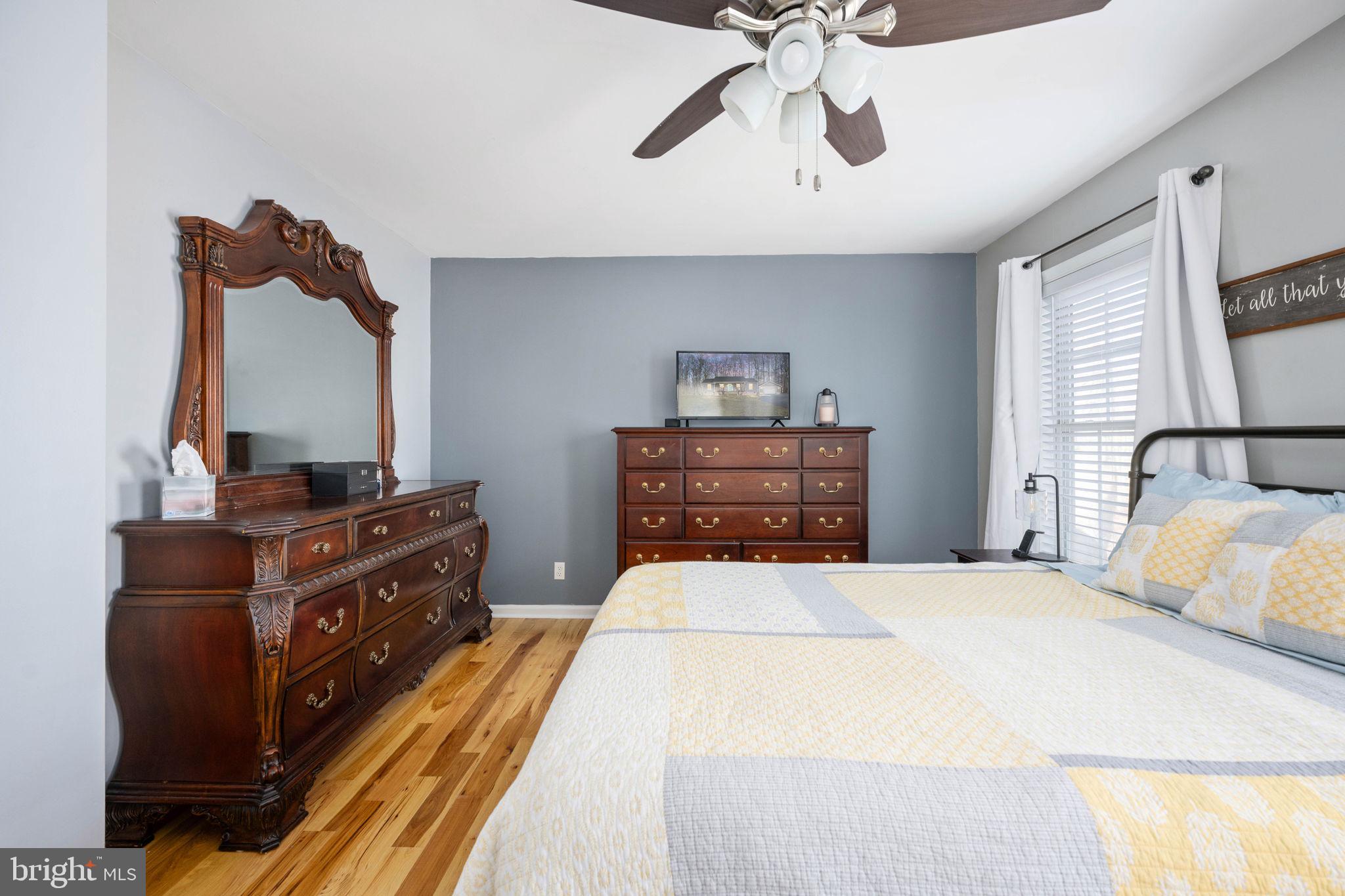 435 Halls Store Road Mineral, VA 23117 - Photo 39 of 59 a bedroom with a bed and dresser with mirror