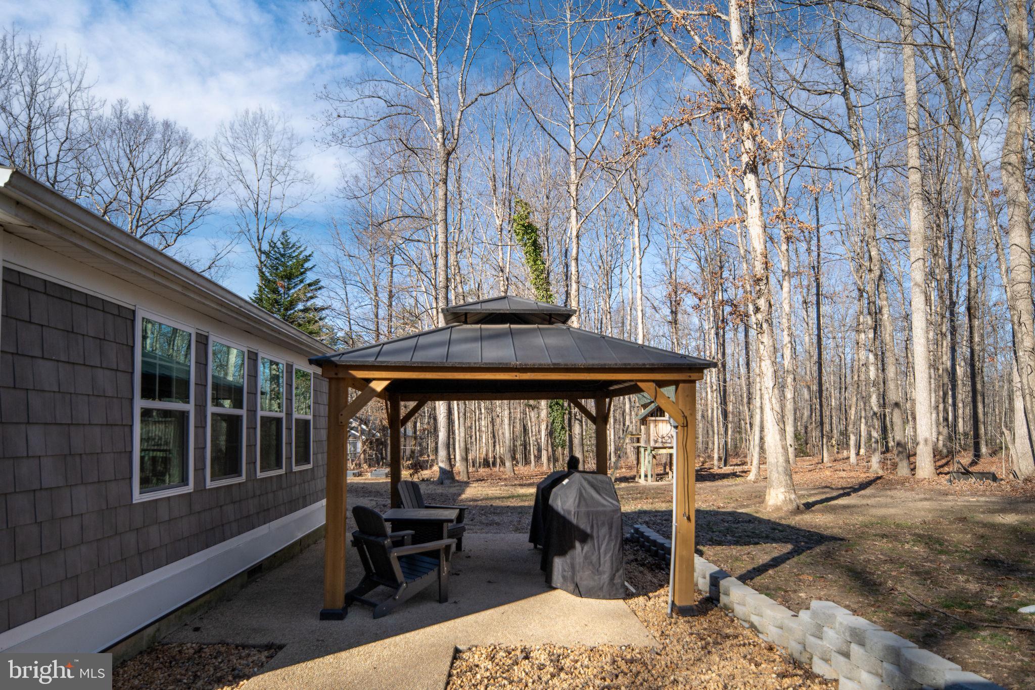 435 Halls Store Road Mineral, VA 23117 - Photo 48 of 59 a view of a two chairs and table in the patio