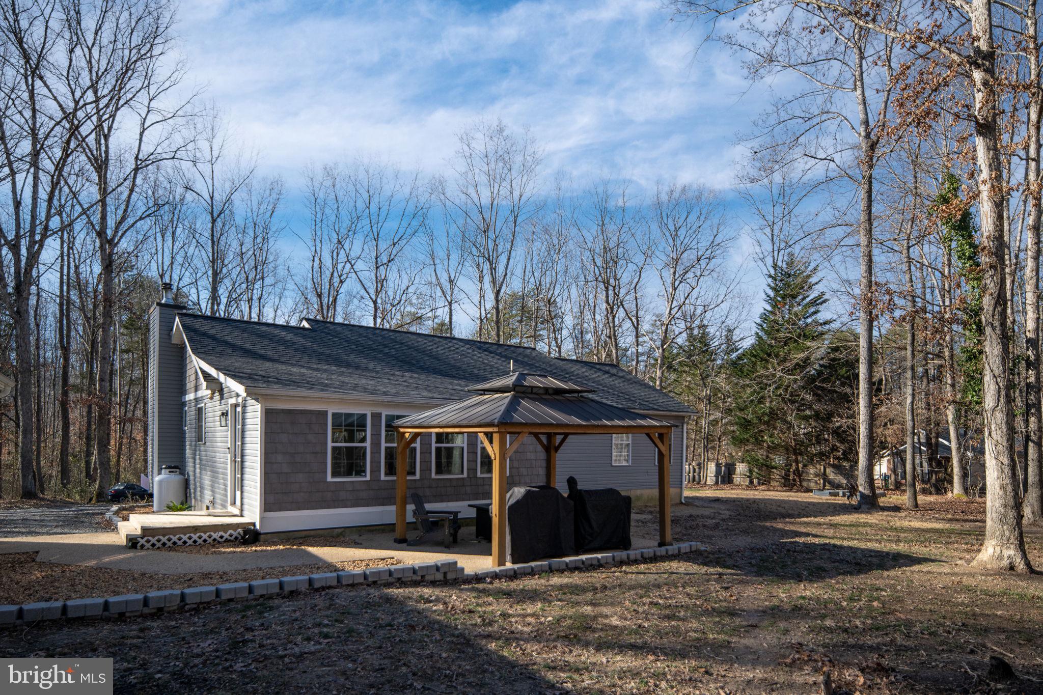 435 Halls Store Road Mineral, VA 23117 - Photo 52 of 59 a view of a house with a yard and large tree