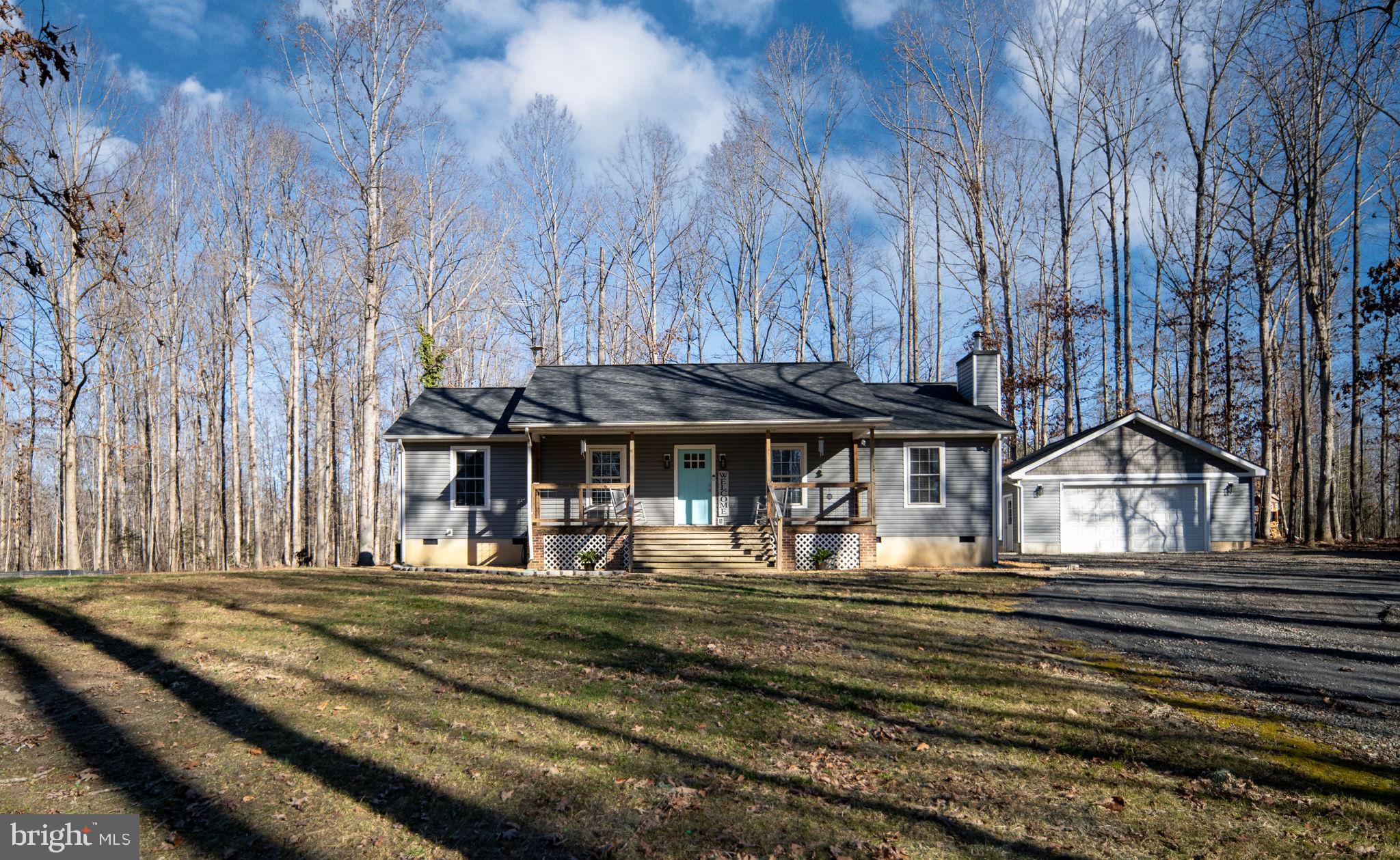 435 Halls Store Road Mineral, VA 23117 - Photo 8 of 59 a view of a house with a yard