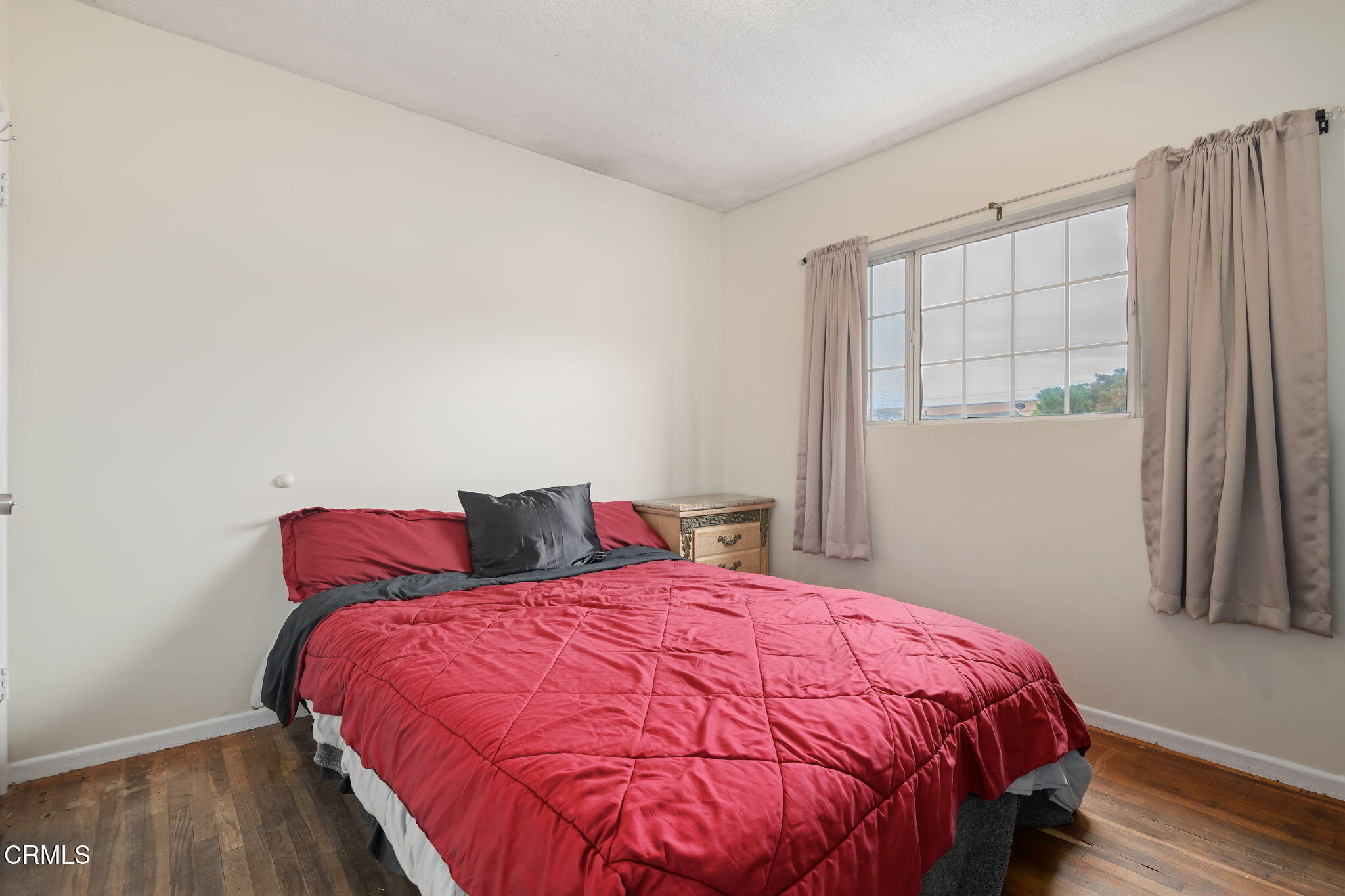 309 Rosa Street West Oxnard, CA 93033 - Photo 12 of 18 a bed sitting in a bedroom next to a window