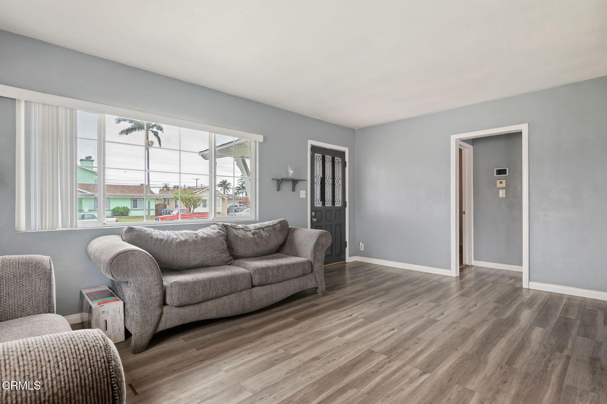 309 Rosa Street West Oxnard, CA 93033 - Photo 6 of 18 a living room with furniture and a large window