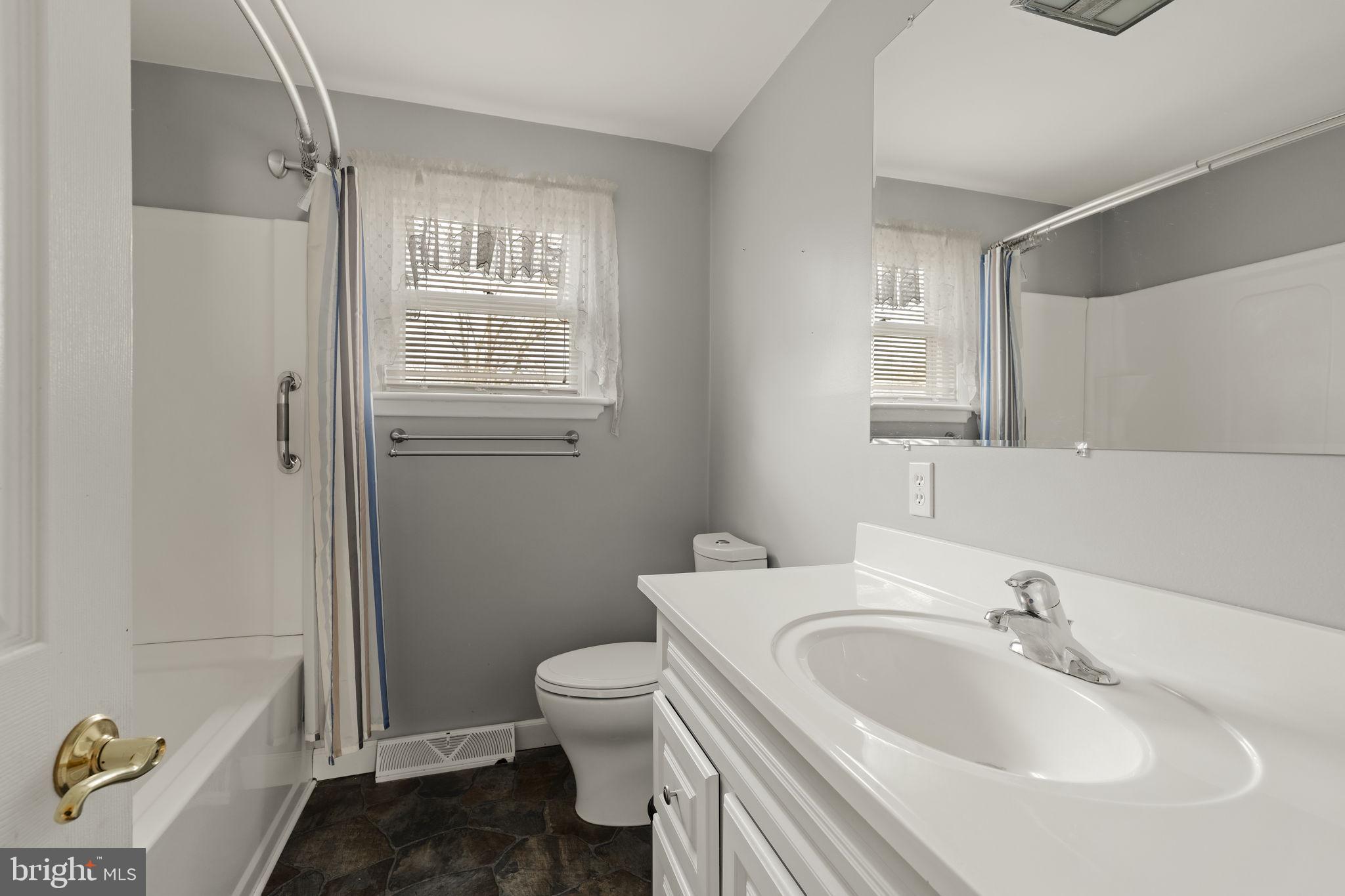 406 South Church Street Quarryville, PA 17566 - Photo 12 of 24 a bathroom with a sink toilet and shower