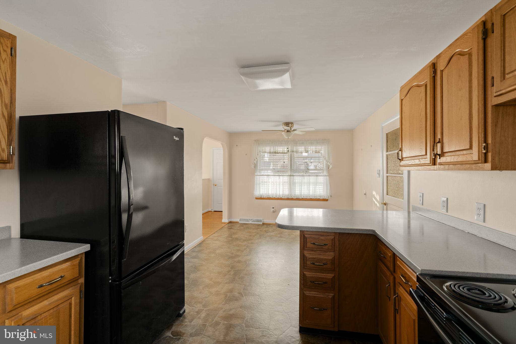 406 South Church Street Quarryville, PA 17566 - Photo 6 of 24 a kitchen with stainless steel appliances granite countertop a refrigerator and a stove top oven