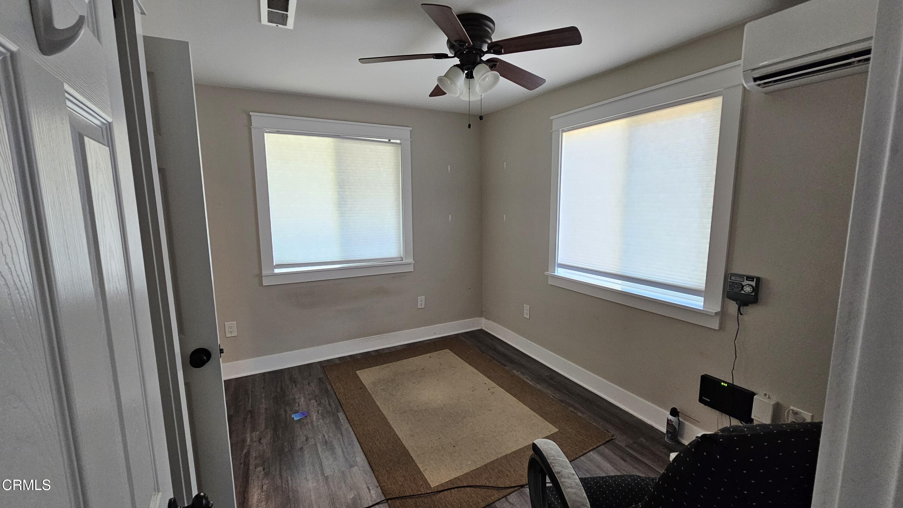 1032 West Newgrove Street Lancaster, CA 93534 - Photo 9 of 13 a view of a workspace with furniture and a window