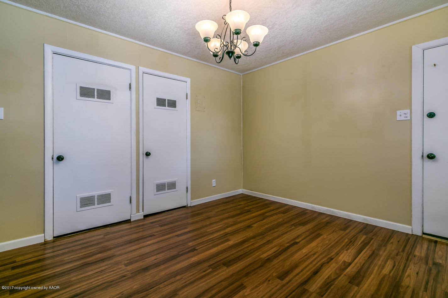 4708 South Fannin Street Amarillo, TX 79110 - Photo 5 of 16 a view of a hallway with wooden floor
