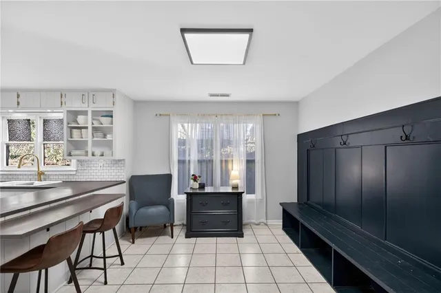 a dining room with furniture and window