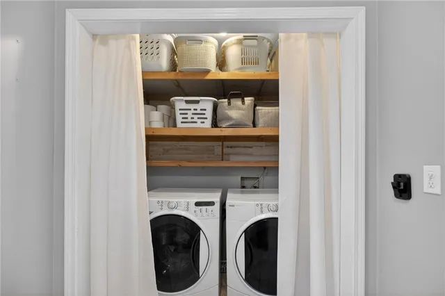 a utility room with dryer and washer