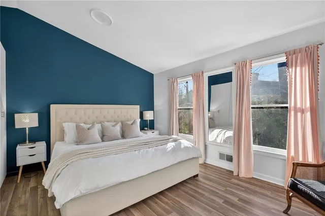 a bedroom with a bed and a view of bedroom