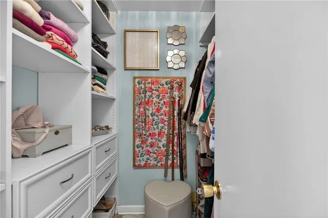 a bathroom with a toilet and a shower curtain