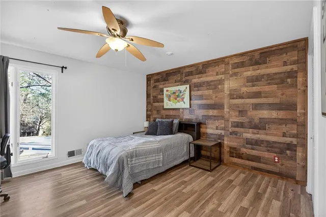 a bed room with a bed and a window