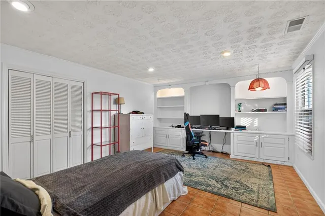 a bedroom with a bed and furniture