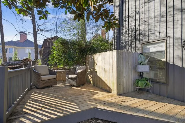 a view of a terrace with couches and potted plants