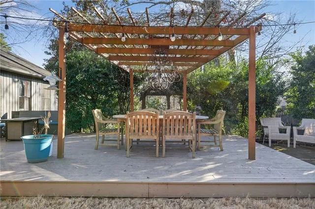 a view of a chairs and table in backyard