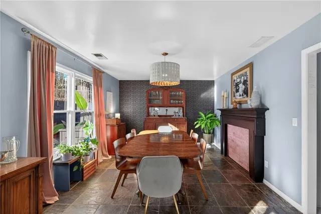 a view of a dining room with furniture window and outside view